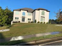 Stunning two-story home boasting a manicured lawn and a classic architectural design at 3312 Steeple Chase Sw Way, Conyers, GA 30094