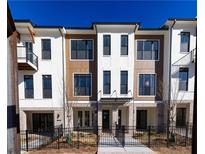 Charming townhome with a blend of brick, siding and well-manicured lawn at 334 Olmstead Way # 37, Alpharetta, GA 30022