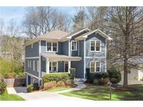 Charming two-story home featuring a welcoming front porch and manicured landscaping at 152 Park Dr, Decatur, GA 30030