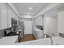 Bright kitchen featuring stainless steel appliances, quartz countertops and grey shaker cabinets at 3636 Habersham Nw Rd # 2208, Atlanta, GA 30305