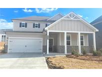 Charming two-story home with a covered front porch and a two-car garage at 2694 Mourning Dove Drive (Lot 35), Grayson, GA 30017