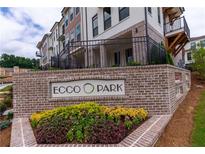 Ecco Park community signage featuring brickwork and manicured landscaping at 338 Olmstead Way # 35, Alpharetta, GA 30022