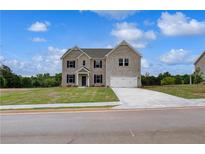 Charming two-story home featuring a well-manicured lawn and a spacious two-car garage at 111 Felicity Pike, Locust Grove, GA 30248