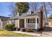 Charming craftsman-style home with a cozy front porch and well-maintained landscaping at 971 Cherokee Se Ave, Atlanta, GA 30315