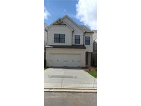 Charming two-story home boasts white siding, a two-car garage, and a welcoming facade at 1063 Crest Mill Dr, Marietta, GA 30008