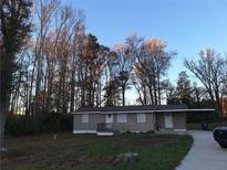 Charming single-story home featuring a covered carport and welcoming front porch at 3105 Hwy 78, Loganville, GA 30052