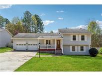 Charming home with two-car garage, inviting porch, and well-maintained front lawn at 1532 Wethersfield Rd, Snellville, GA 30078