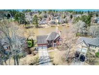 Beautiful two-story brick home features an attached garage and a well-maintained yard with lake views at 5529 Camden Lake Pointe Nw, Acworth, GA 30101