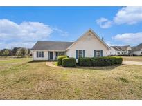 Charming single-story home with blue shutters and manicured hedges at 340 Nail Rd, Mcdonough, GA 30253