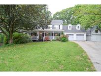 Charming two-story home with a large front porch and well-manicured lawn at 5500 Georgetown Sw Trce, Lilburn, GA 30047