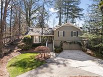 Charming two-story home featuring a well-manicured front yard and a two-car garage at 2630 Orchard Knob Se, Atlanta, GA 30339