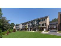Modern townhomes with stone accents and manicured lawns, offering stylish and low-maintenance living at 3784 Jack Vernon Cir, Powder Springs, GA 30127