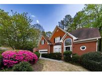 Charming brick home with manicured landscaping and inviting curb appeal at 3117 Kings Arms Ne Ct, Atlanta, GA 30345
