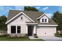 Charming single-Gathering home showcasing light siding, a two-car garage, and a well-manicured lawn at 2044 Ripple Park Bend, Canton, GA 30114