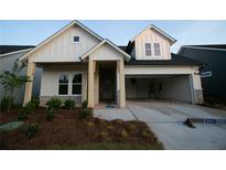 Charming single-Gathering home with a welcoming front porch and two-car garage in a suburban neighborhood at 2044 Ripple Park Bnd, Canton, GA 30114