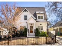 Charming two-story home boasts a landscaped yard and a classic, eye-catching exterior at 263 Mathews Ne Ave, Atlanta, GA 30307