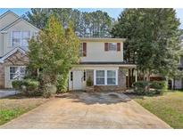 Charming two-story home features a double-wide driveway, brick accents, and a well-maintained lawn at 3652 Platina Park Ct, Decatur, GA 30034