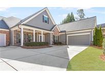 Charming single-Gathering home with a brick and gray siding exterior and manicured lawn at 1874 Manor View Nw Cir # 4, Acworth, GA 30101