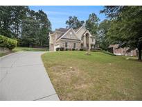 Charming brick home with a manicured front lawn and inviting curb appeal at 3928 Herron Sw Ln, Atlanta, GA 30349