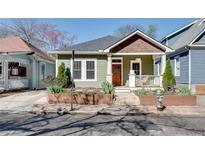 Charming single-story home featuring a cozy front porch and well-manicured landscaping at 280 Josephine St, Atlanta, GA 30307