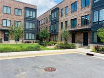 Brick townhomes offer classic style and contemporary living with beautifully landscaped greenery at 269 Castleberry Station Dr, Atlanta, GA 30313