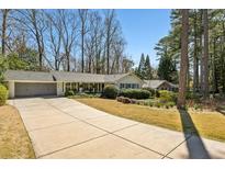 Charming ranch home featuring a long driveway and well-manicured landscaping at 2173 Lebaron Ne Dr, Atlanta, GA 30345