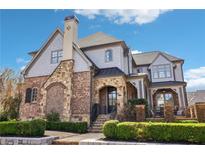 Charming two-story home with brick and stone accents, complemented by manicured landscaping at 4224 Dogwood Bend Park, Duluth, GA 30096