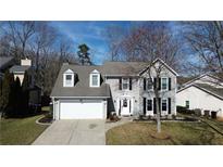 Charming two-story home with gray siding, dormer windows, and an attached two-car garage at 3179 Dunlin Lake Rd, Lawrenceville, GA 30044