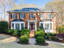 Charming two-story brick home with a manicured front yard and dark shutters at 2262 Rushmore Dr, Marietta, GA 30062