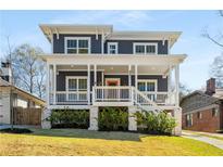 Charming two-story home with a welcoming front porch and well-maintained landscaping at 431 Clifton Ne Rd, Atlanta, GA 30307