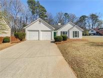 Charming single-story home with a two-car garage, well-manicured lawn, and attractive landscaping at 2917 Yukon Nw Trl, Acworth, GA 30101