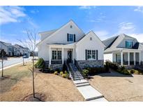 Charming single-Gathering home featuring stone accents, a well-maintained yard, and a welcoming front porch at 2800 Stonecrest Aly, Woodstock, GA 30188