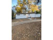 Charming single-story home featuring a well-maintained yard and a welcoming front porch at 1905 Robinhill Ct, Tucker, GA 30084