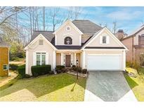 Charming single-Gathering home featuring manicured lawn, attached garage, and inviting front entryway at 2698 Glenrose Hl, Atlanta, GA 30341