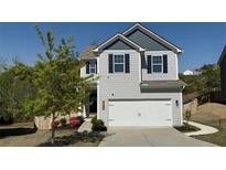 Charming two-story home with a well-maintained lawn and a two-car garage at 3836 Saddle Hill Way, Douglasville, GA 30135