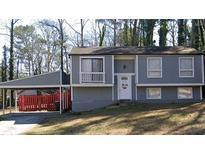 Charming home featuring a covered carport and a welcoming front entrance at 3576 Shrewsbury Ct, Snellville, GA 30039