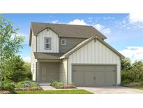 Charming two-story home featuring a modern facade, a two-car garage and lush landscaping at 215 Groveton Ct, Euharlee, GA 30145