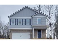 Charming two-story home featuring a brick foundation and a gray-blue facade at 425 Camella Cir, Mcdonough, GA 30252