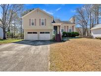 Charming two-story home with a two car garage and a well-manicured front yard at 539 Villa Rosa Rd, Temple, GA 30179