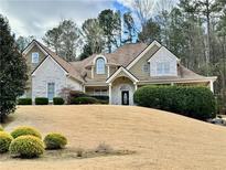 Charming home with a combination of stone and siding, complemented by mature landscaping at 5339 Saville Nw Dr, Acworth, GA 30101