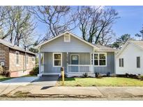 Charming renovated bungalow with a spacious front yard and inviting front porch at 1016 Michigan Nw Ave, Atlanta, GA 30314