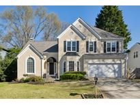 Charming two-story traditional home with manicured lawn and attached two-car garage at 2614 Willow Cv, Decatur, GA 30033