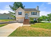 Charming two-story home with a well-maintained lawn and inviting curb appeal at 125 Fairhaven Trl, Fairburn, GA 30213
