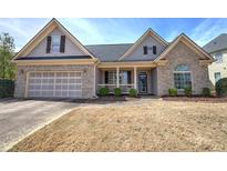 Charming single-Gathering home with a well-manicured lawn and an attached two-car garage at 27 Spring Folly Nw, Cartersville, GA 30121