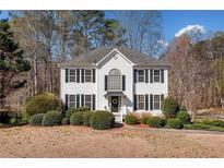 Charming two-story home with black shutters and lush landscaping at 434 Westchester Way, Canton, GA 30115