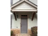 Inviting front door with covered entrance and stone accents providing a welcoming curb appeal at 4155 Park Chase Dr, Atlanta, GA 30344