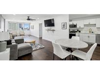 Bright open-concept living room with modern finishes and dining area with lovely city views at 215 Piedmont Ne Ave # 2201, Atlanta, GA 30308