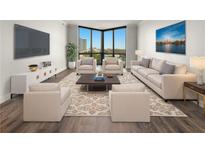 Bright living room features large windows with city views and sleek modern furnishings at 2870 Pharr Court South Nw # 1202, Atlanta, GA 30305