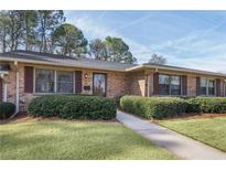 Charming single-story brick home featuring well-maintained landscaping and a welcoming entrance at 3346 Stonecrest Ct, Atlanta, GA 30341