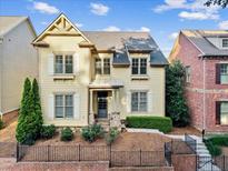 Attractive two-story home with tidy front yard and professionally landscaped garden at 232 Hunt Ne St, Marietta, GA 30060
